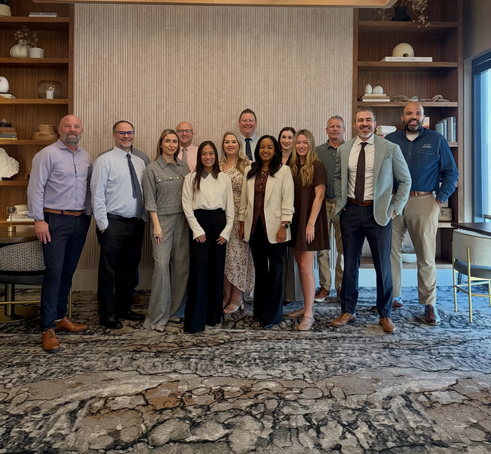The NeoSystems ISG team standing together in the office